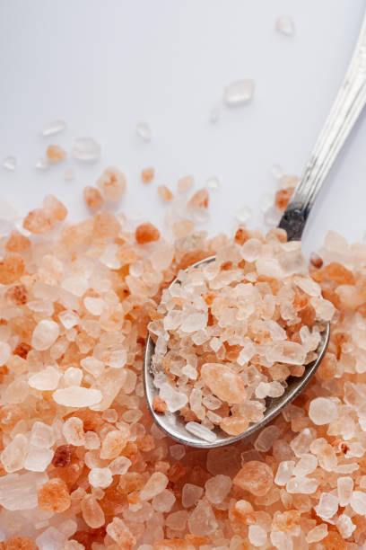 istock pink Himalayan salt on a white background 1393173470