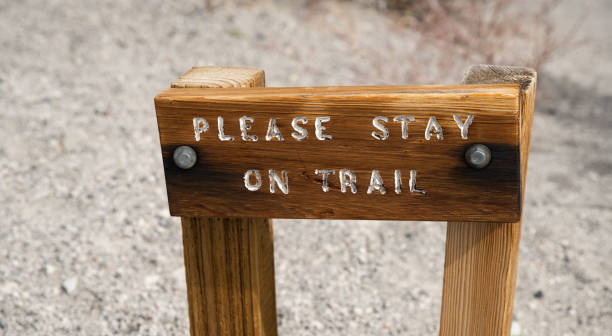 istock Please Stay on Trail -- Leave no Trace Sign at Trailhead 1393177250
