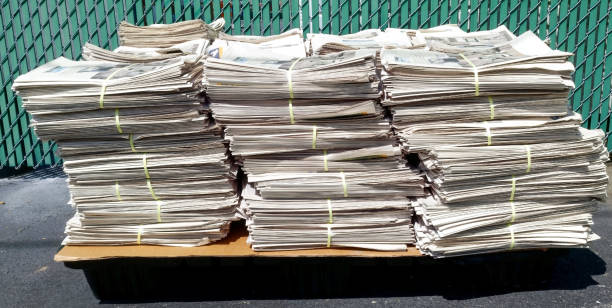 istock Stacks of bundled newspapers 1393177576