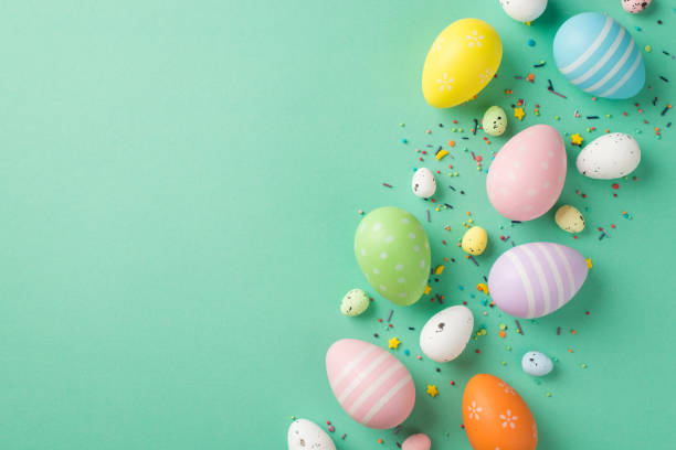 istock Top view photo of easter decorations multicolored easter eggs and confectionery topping on isolated teal background with copyspace 1393182321