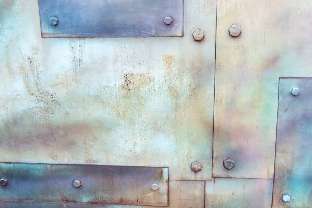 istock Background with metallic coating and bolts 1393186498