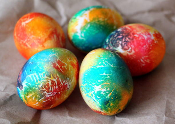 istock Happy Easter. Traditional holiday poster with cute painted eggs on wrapping paper. 1393190260