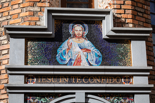 Vilnius, Lithuania - March 26, 2022: Mosaic above the entrance into the Sanctuary of the Divine Mercy in Vilnius, Lithuania. Text in Latin: Jesus I believe in you