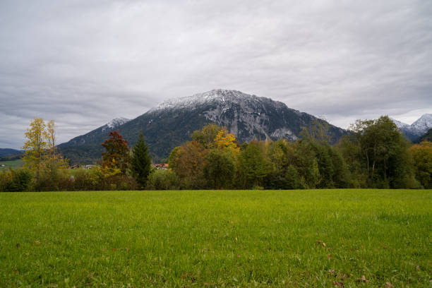 istock Panoramic view of a mountain with snowy peak in autumn 1393190588
