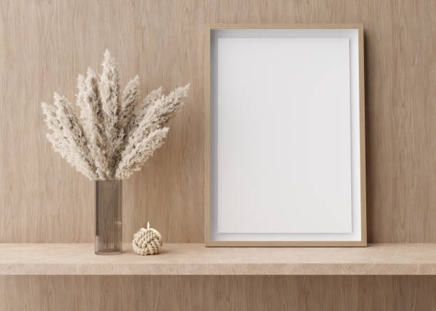 istock Empty vertical picture frame standing on shelve in modern room. Mock up interior in contemporary style. Free, copy space for picture. Pampas grass in vase, candle. 3D rendering. 1393191326