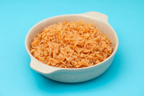 istock tomato rice on the dish on blue background 1393197756