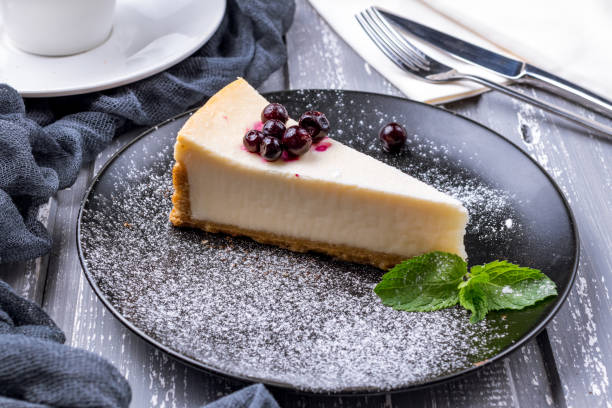 istock cheesecake with black currant on black plate 1393198179
