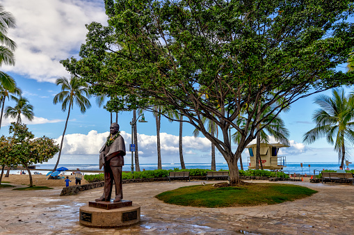 Waikiki, Hawaii - March 28, 2022: Restaurants, shops and scenery along Kalakaua Avenue in Waikiki