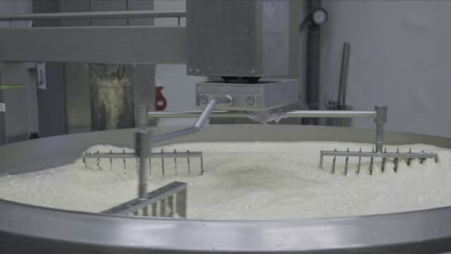 Machine mixing milk curd