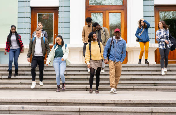 istock Students leaving the university after their lessons 1393223593
