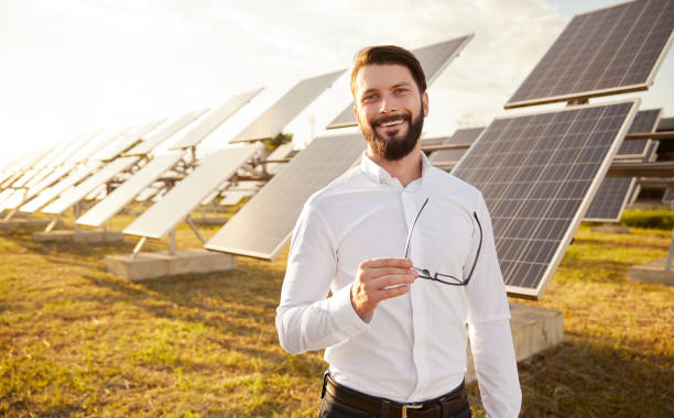 istock Manager in field with photovoltaic panels 1393223687