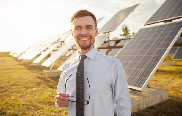 istock Cheerful investor on solar farm 1393223689