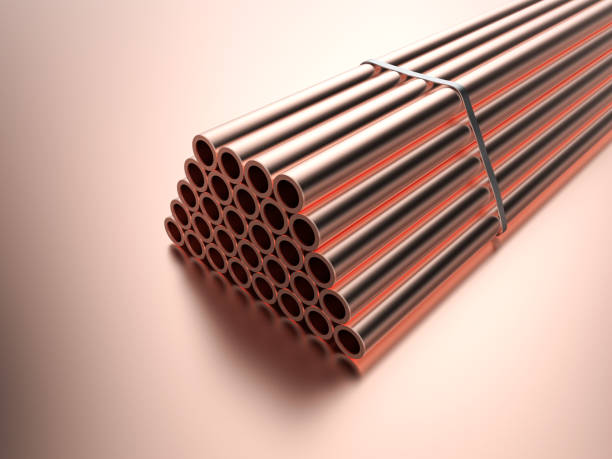 istock Heap of shiny copper pipes 1393223731