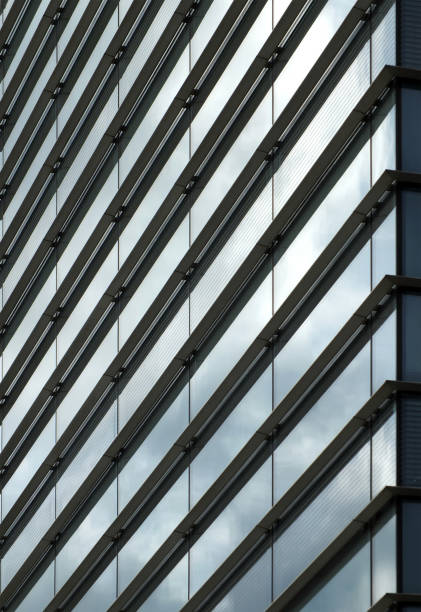 istock full frame modern office architecture abstract with geometric shapes and buildings reflected in blue glass windows 1393224843