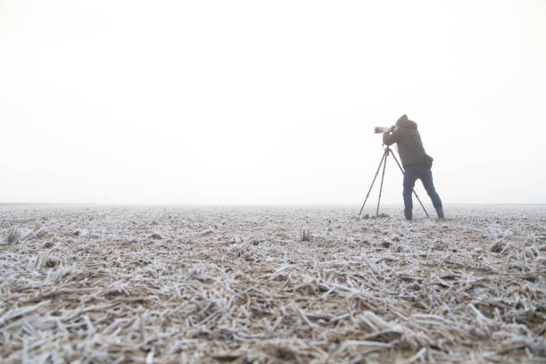 istock man taking picture in foggy 1393228087