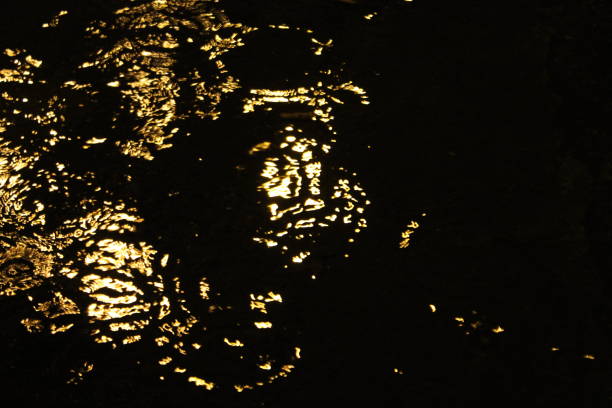 Rainwater waves at Night under streetlight