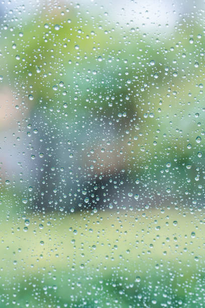 Raindrops on the glass in the image of the rainy season Raindrops on the glass in the image of the rainy season water thinking bubble drop stock pictures, royalty-free photos & images