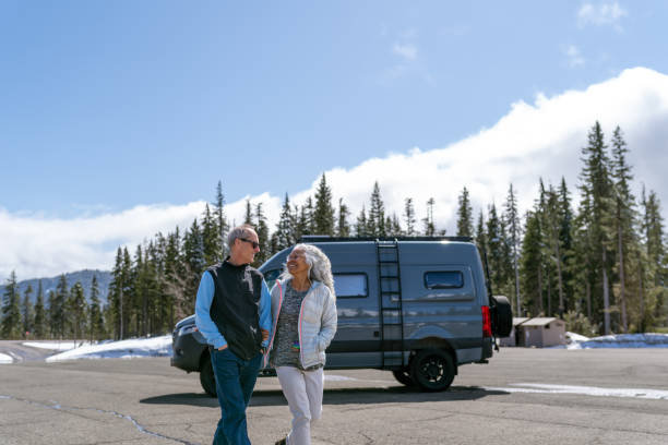 istock Active senior couple enjoying nature while traveling in camper van 1393230564
