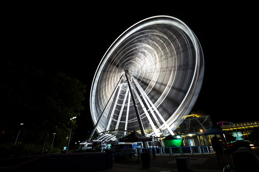 Brisbane, Australia - October 05, 2018: Long exposure night view of the famous Brisbane Wheel.