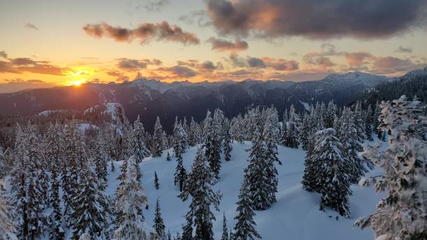 istock Beautiful sunset at snowcapped mountain top 1393234572