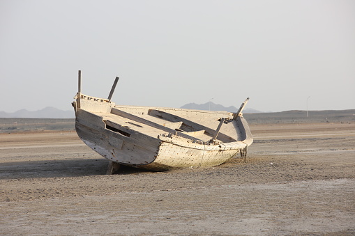 Old deserted boats once used for transportation and shipping as seen in Masirah Island in Oman