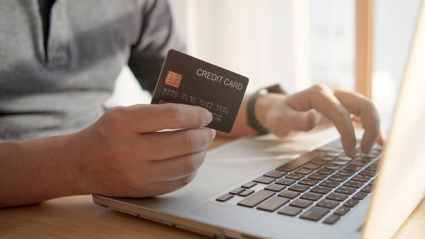 istock hand typing on a laptop keyboard while making financial transactions with a credit card 1393244770