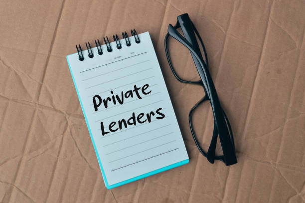 istock Notebook written with text PRIVATE LENDERS over cork board background. 1393245488