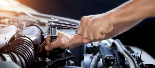 istock Car mechanic working on car engine, car maintenance concept. 1393252840