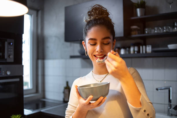 istock A young woman eats oatmeal 1393258750
