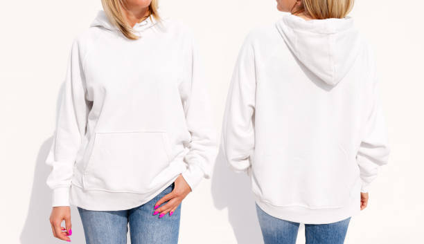 Model wearing white women's hoodie, mockup for your own design Model wearing white women's hoodie, mockup for your own design hooded shirt stock pictures, royalty-free photos & images