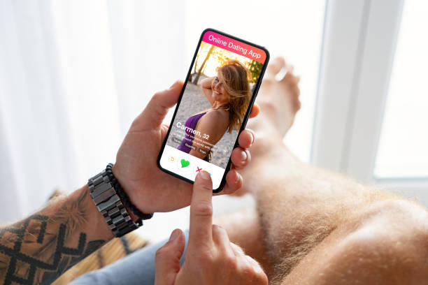 istock Man using online dating app on his mobile phone 1393264558
