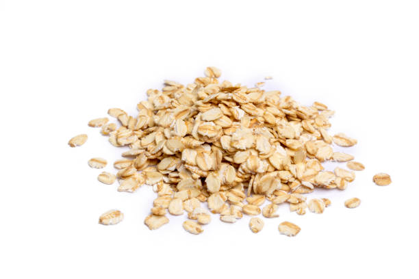 istock Heap of dry rolled oats isolated 1393265495