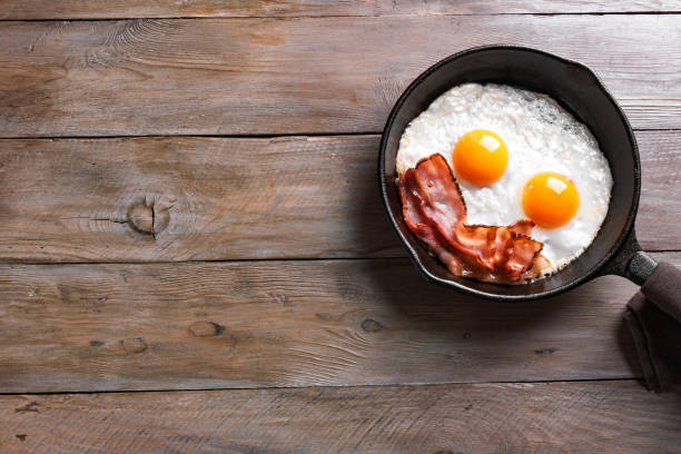Fried eggs and bacon stock photo