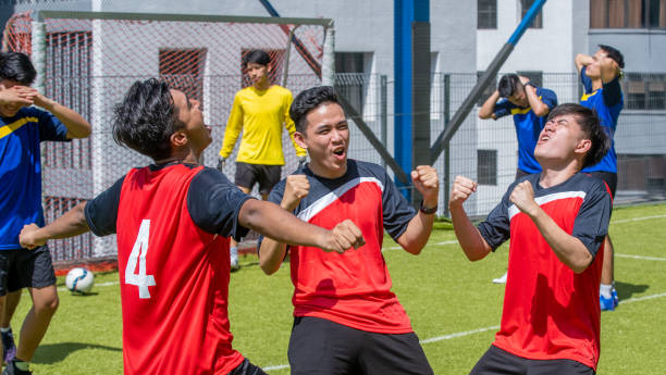 istock A team runs together after scoring a goal 1393266337