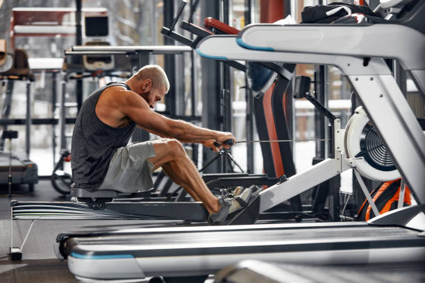 istock Training legs in the simulator, the athlete works with his legs on the simulator, working out the muscles on the legs 1393268015