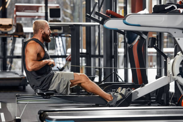 istock Training legs in the simulator, the athlete works with his legs on the simulator, working out the muscles on the legs 1393268018