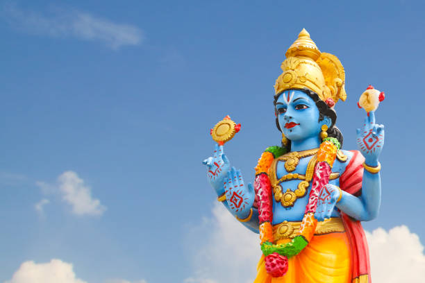 istock Hindu god Perumal statue on temple tower 1393270604