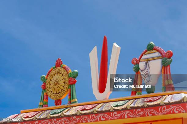 Perumal Naama Statue With Shanku And Chakra On Temple Tower Stock Photo - Download Image Now