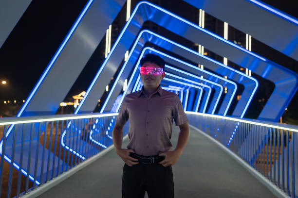istock Asian man wearing smart luminous glasses 1393272855