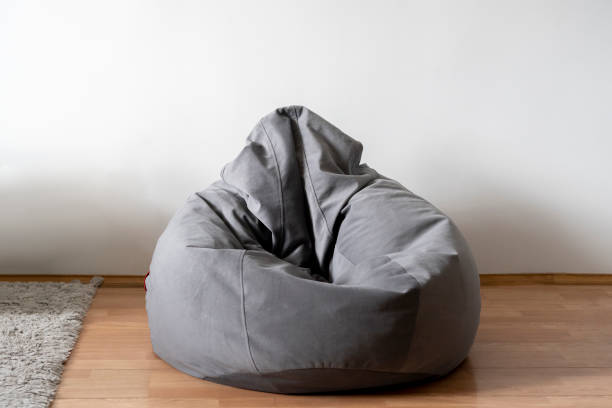 grey bag chair or bean armchair at home in living room grey bag chair or bean armchair at home in living room bean bag stock pictures, royalty-free photos & images