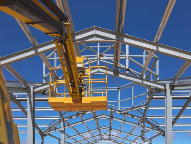 istock yellow lifting platform for construction in the construction of a metal structure 1393275553
