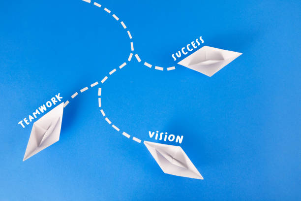 istock Teamwork Concept with Paper Boats 1393275787