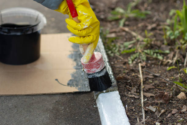 istock Painting with black paint. Paint on a molar brush. 1393276947