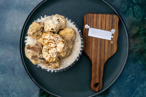 Italian White Truffle with a wooden shaver stock photo