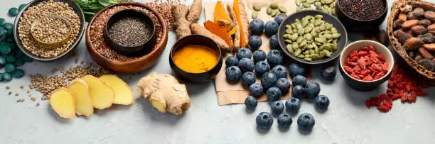 Healthy food clean eating selection on light background. Balanced diet concept. Superfood assortment. panorama, copy space