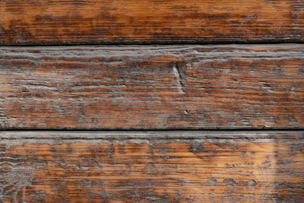 istock Brown wood texture background coming from natural tree. The wooden panel has a beautiful dark pattern, hardwood floor texture 1393284155