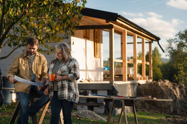 istock Mature couple having coffee break when working together on construction site of their new house. 1393287165