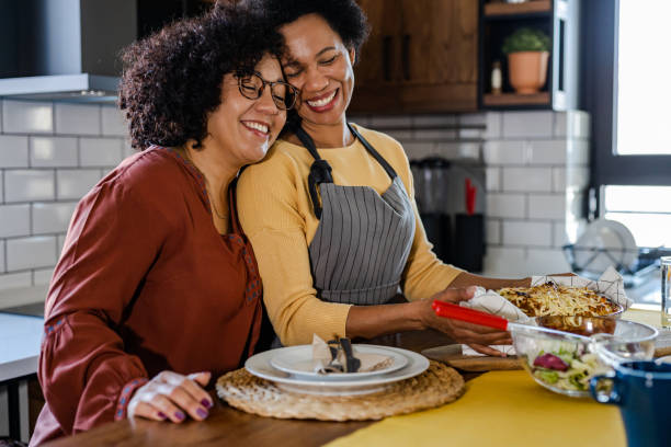 istock Romantic lesbian couple in the kitchen 1393314070
