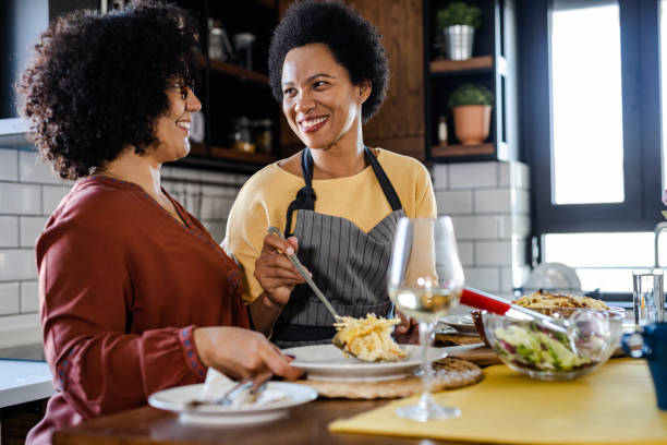 istock Lesbian couple having lunch at home 1393314825