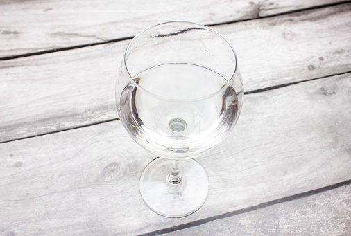 The Glass goblet with boiled water. Clean drinking water in a glass.